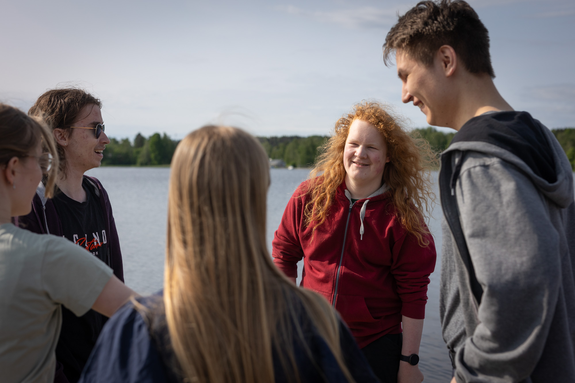 Young people talking outdoors.
