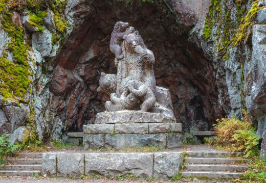 Statue of a mother bear with playful cubs in the Bear's Cave.
