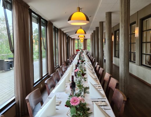 A festive table setting on the glass veranda.