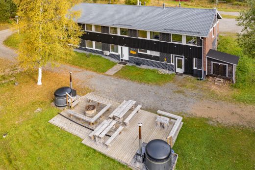 Aerial view of the grand villa with a barbecue area and a hot tub in the foreground.