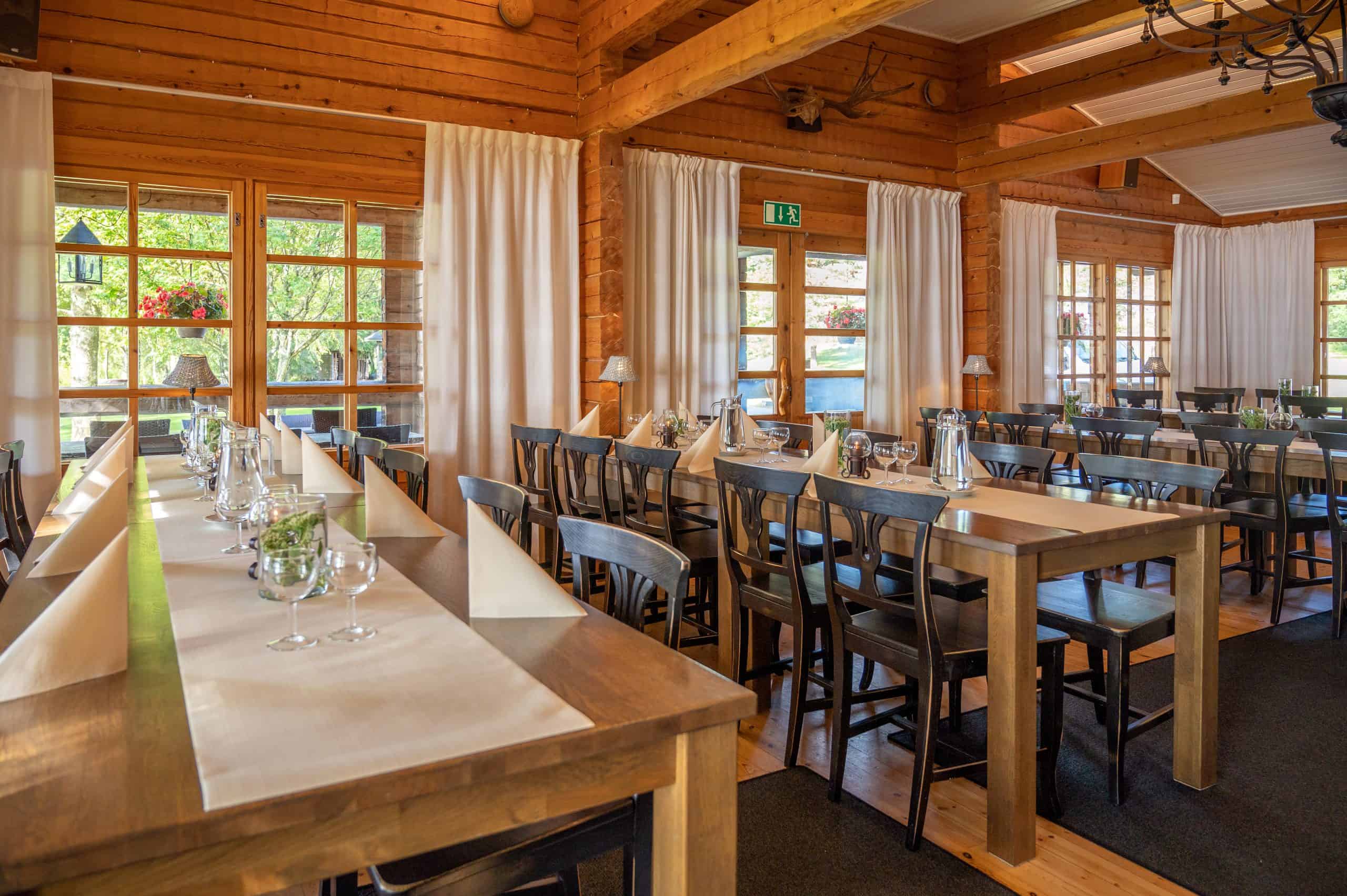 The restaurant hall set up and ready. Large checkered windows at the back let in plenty of light.