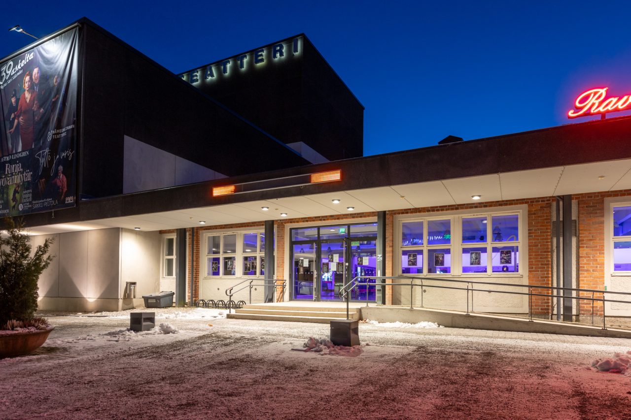 The theatre building in a winter landscape.