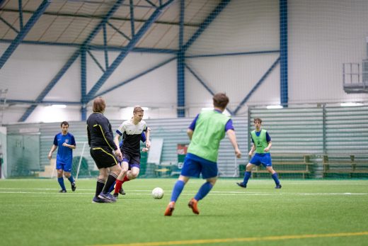 Athletes playing football.