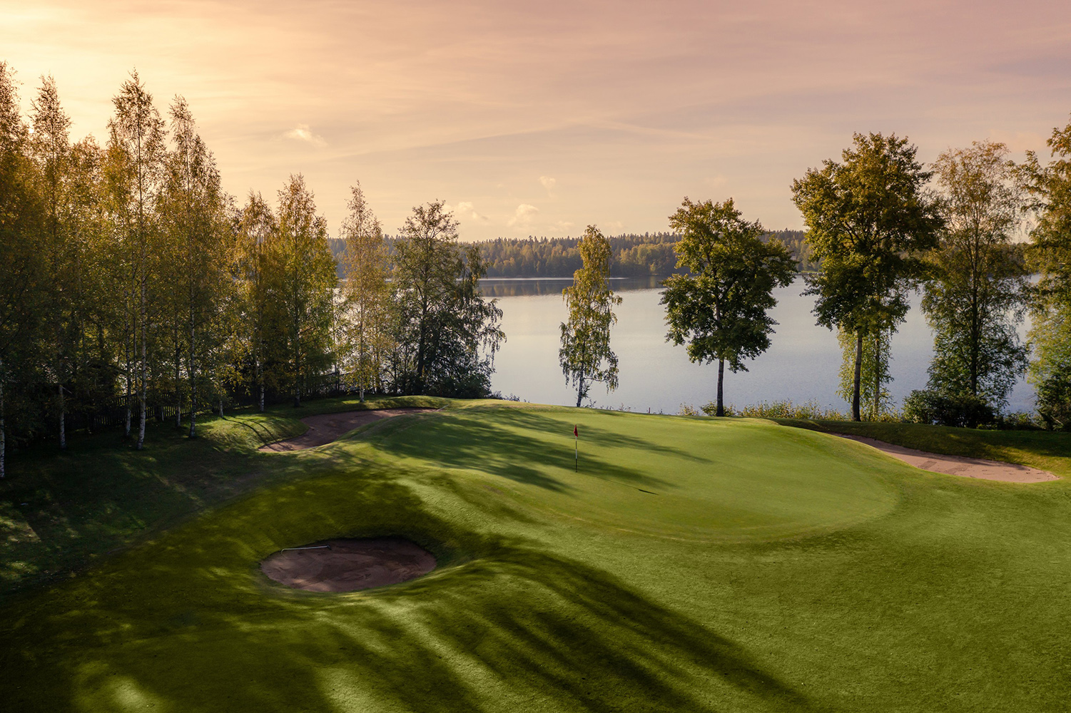 Tawast golf course at sunset on the shore of Lake Katumajärvi
