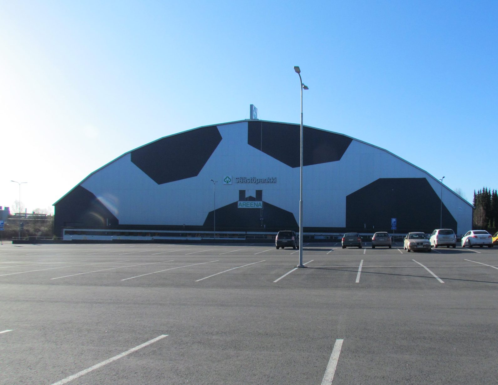 The Säästöpankki Areena building, photographed from the parking lot. The building's pattern resembles a football.