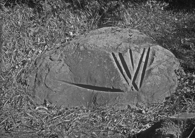 A stone with marks made by a sword.