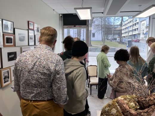 People at the opening of Aimokoulu's final exhibition.