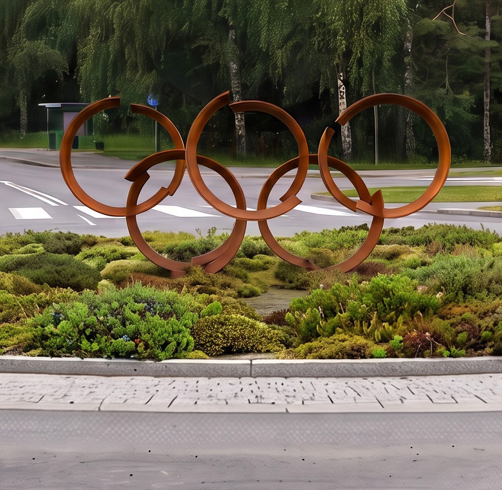 Kuvassa olympiarengaiden muodoista koostuva teos kuvitteellisessa kiertoliittymässä