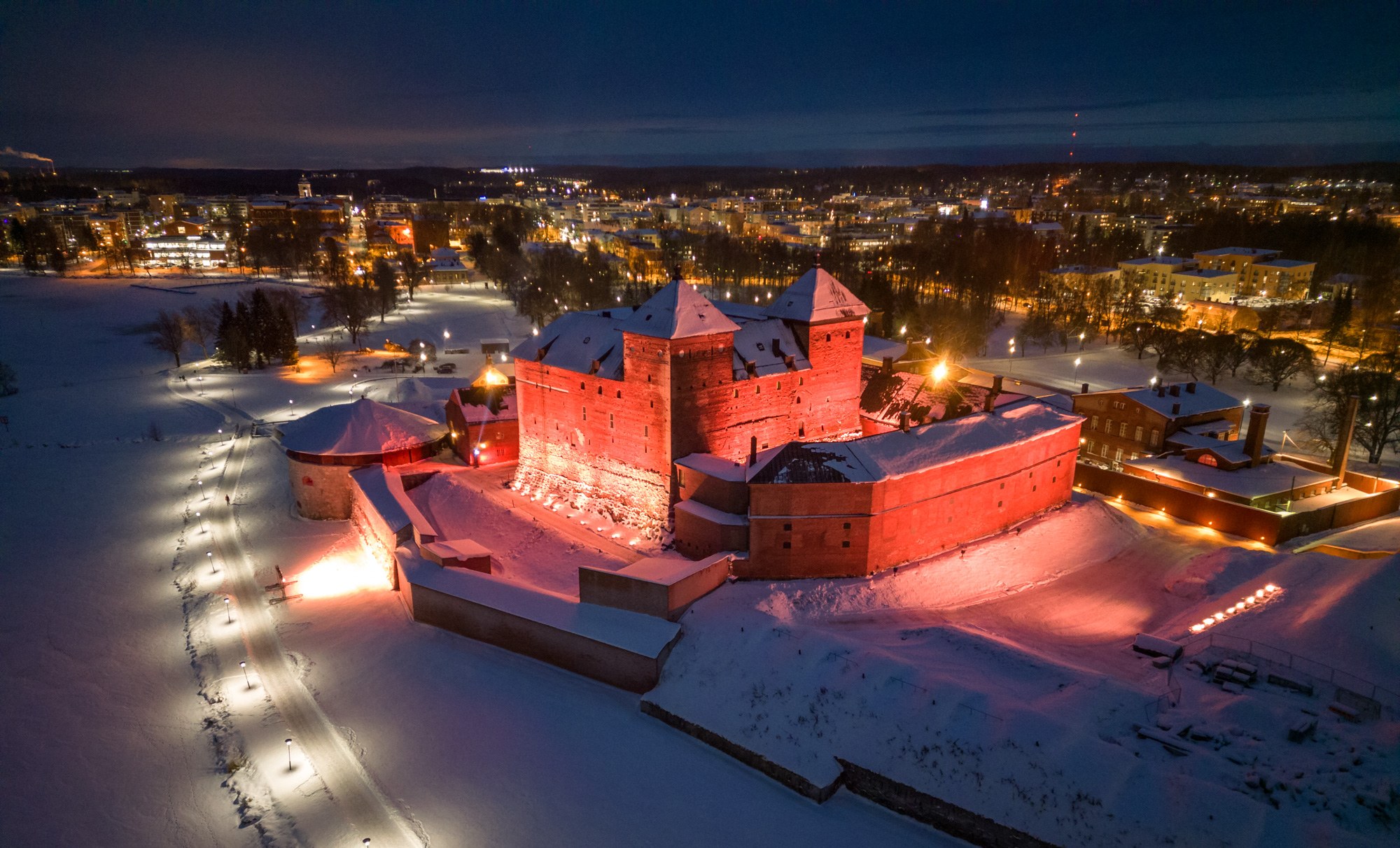 Illuminated Häme Castle from a bird's-eye view
